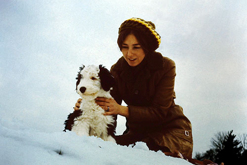 Lynn holding Farley on a hill